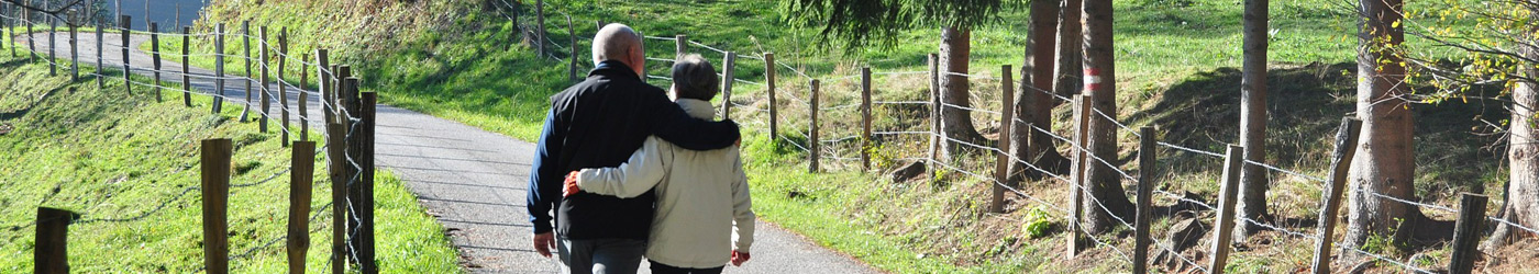 Two people walking in the countryside